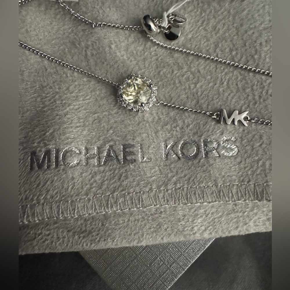 Micheal kors bracelet. New with pouch and tags.
